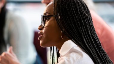 closeup side profile of professional in meeting