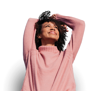 Portrait of happy young woman looking up