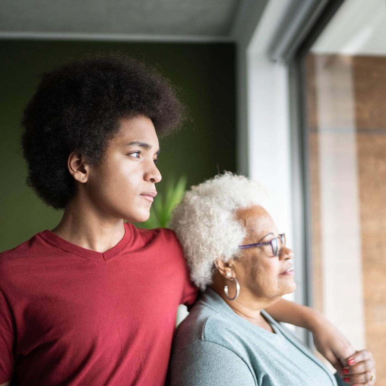 Grandmother and grandson contemplating at home