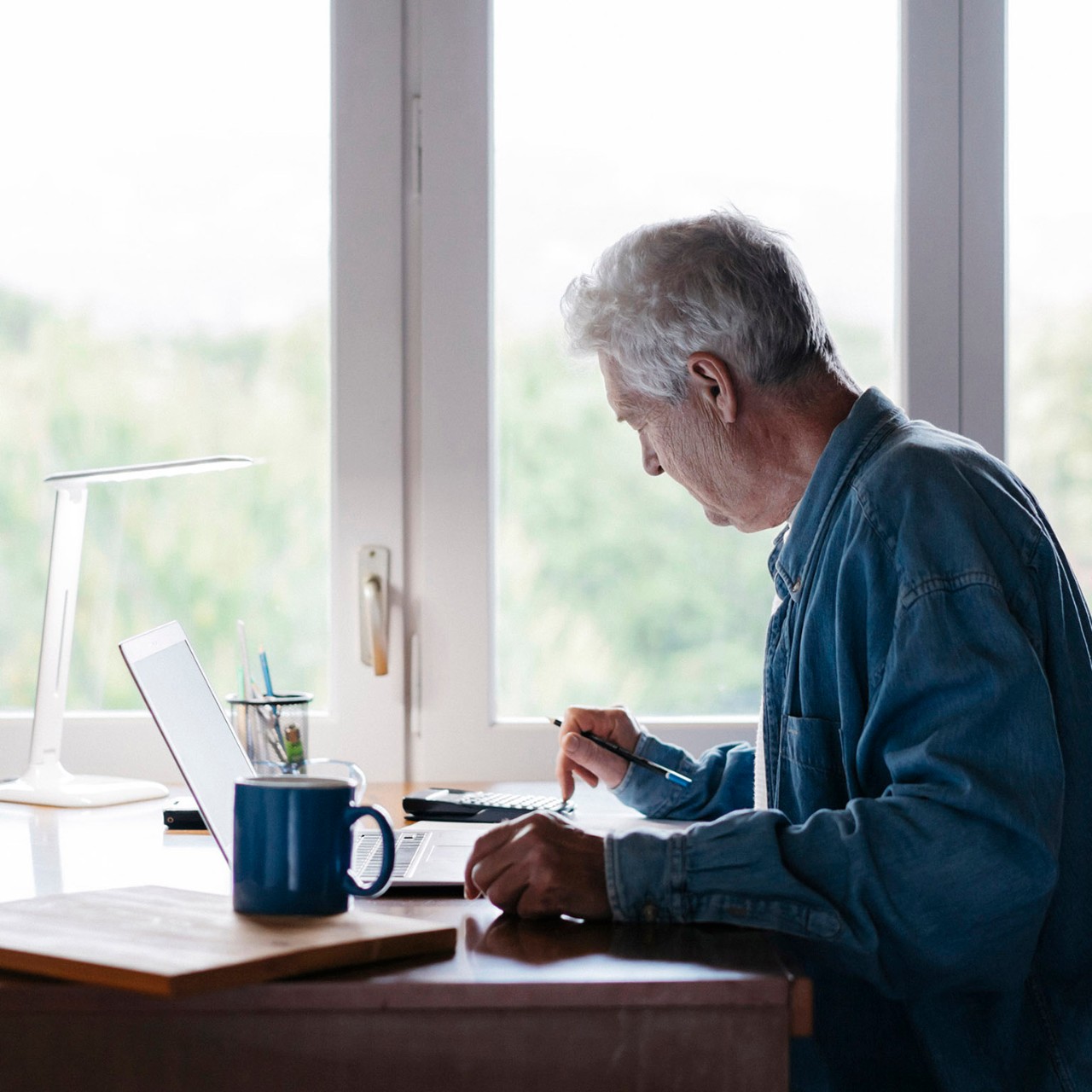 older man checking his financial accounts