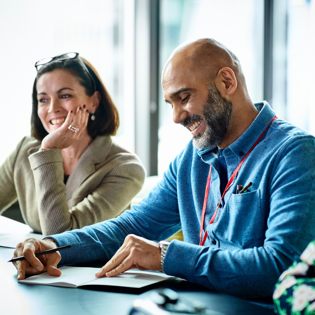 Smiling mature businessman during meeting in modern office